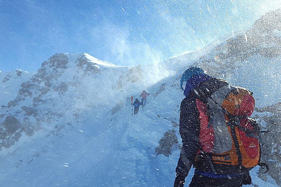snows kicked up during trek up mountains