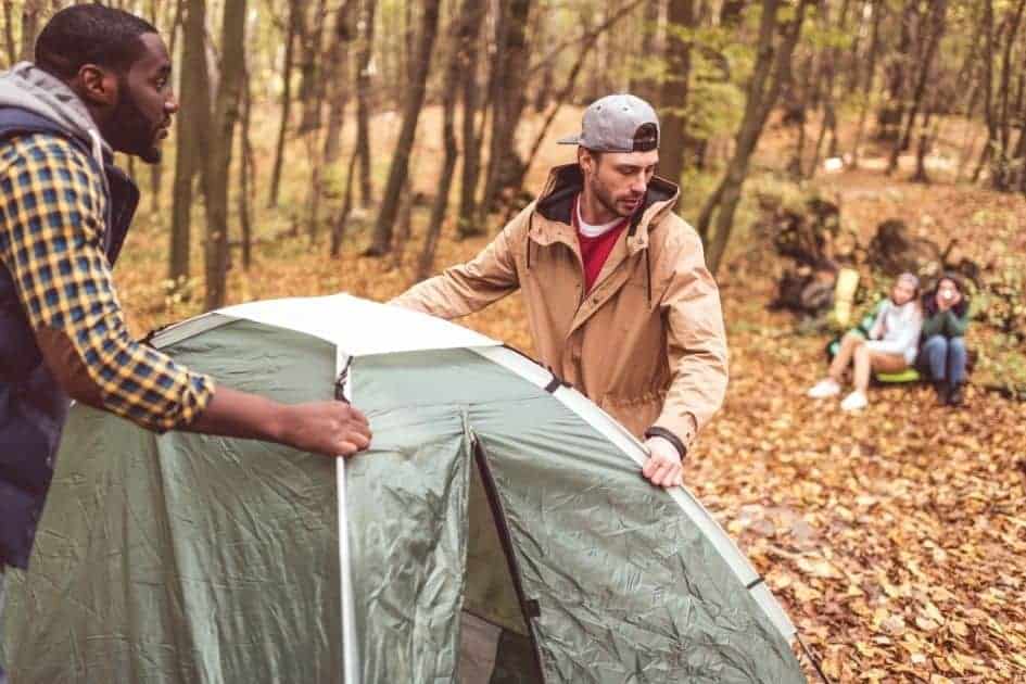 friends pitching a tent