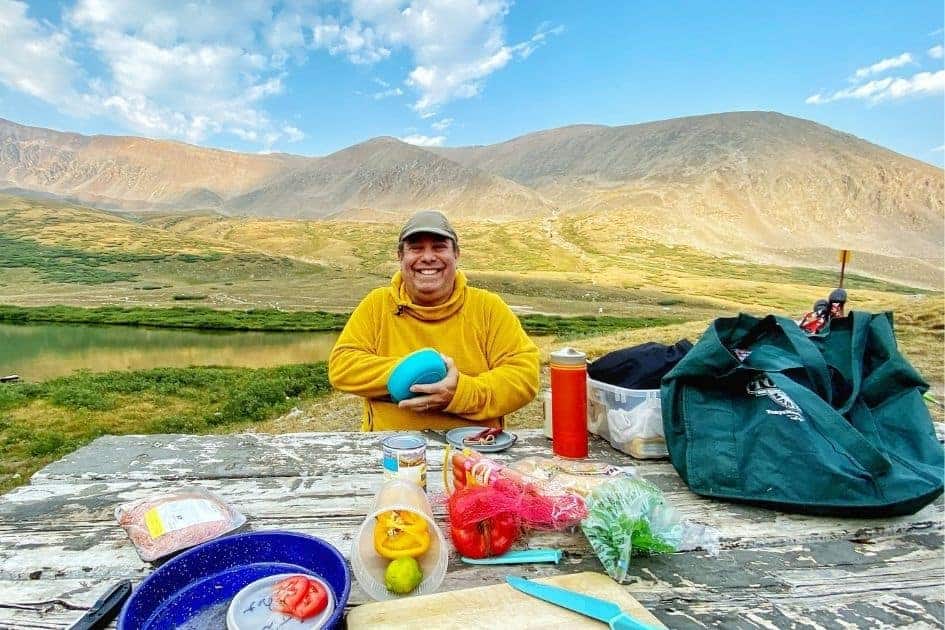 Camper with his portable camping kitchen set up