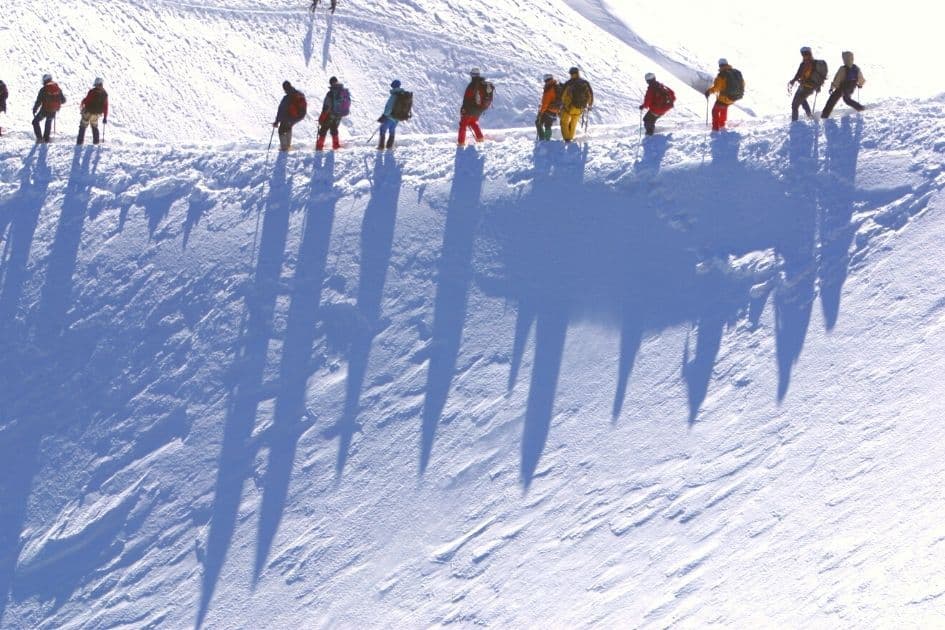 hikers on mountain in winter