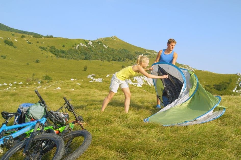 friends pitching a fast pitch tent