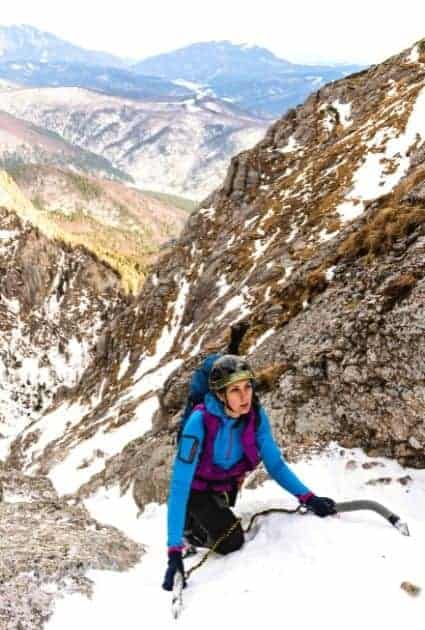Mountaineer climbing with ice axe