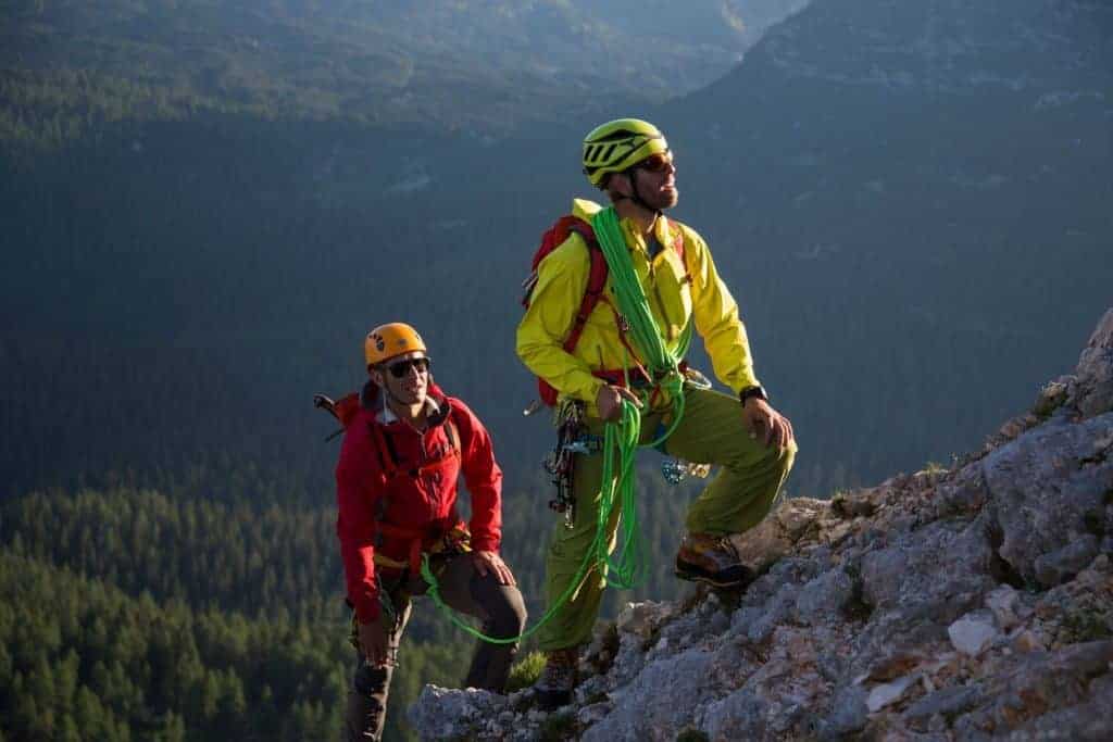 mountaineers with climbing ropes and hiking boots