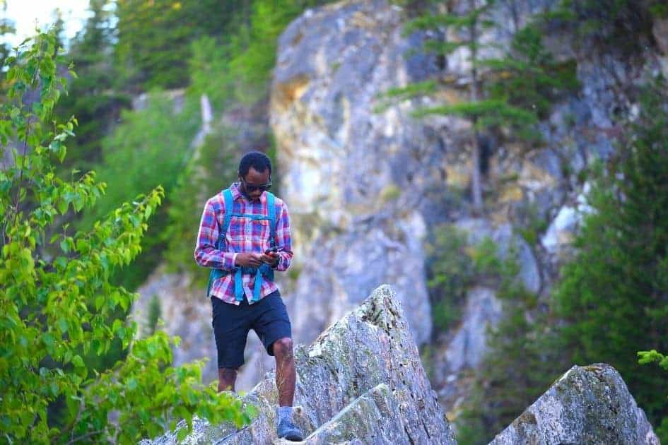 Hiker using GPS device