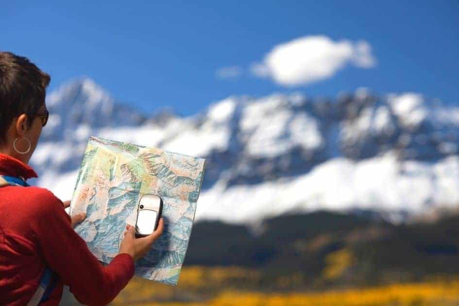 Hiker using a satellite gps navigator