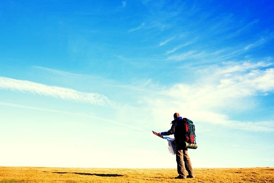 hiker looking at map- he would benefit from a Mini satellite messenger