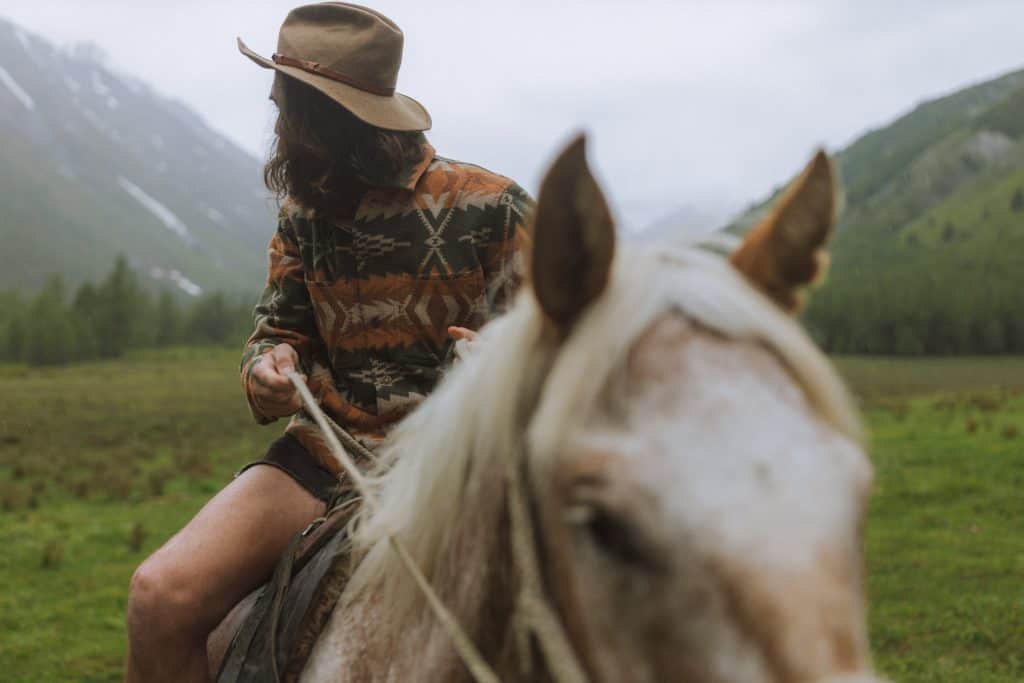 horseback riding - with sun hat