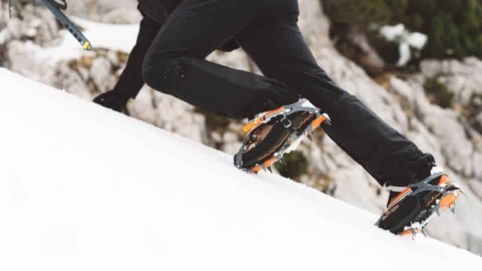ice climbing crampons up a hill