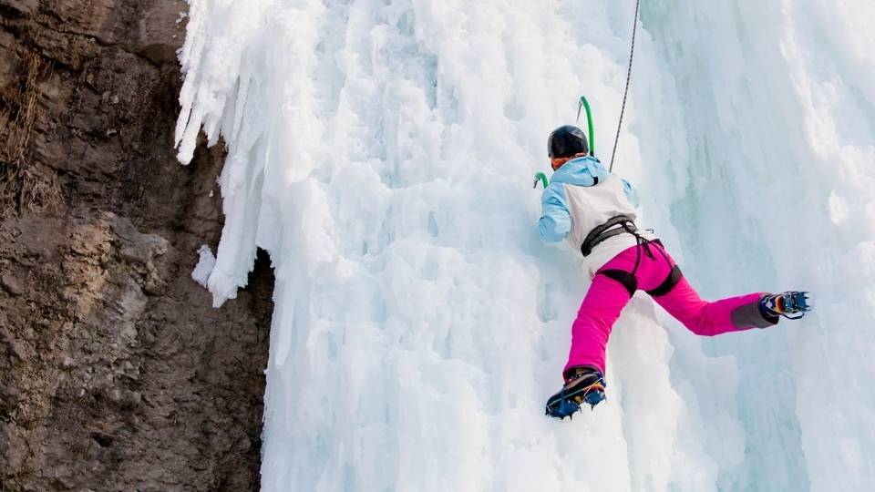 woman ice climbing