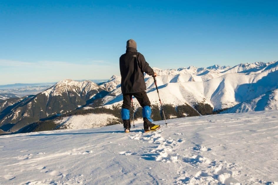 winter hiker with trekking poles