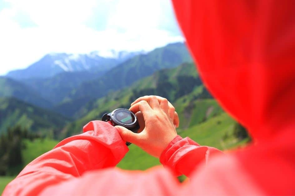 hiker checking hiking watch