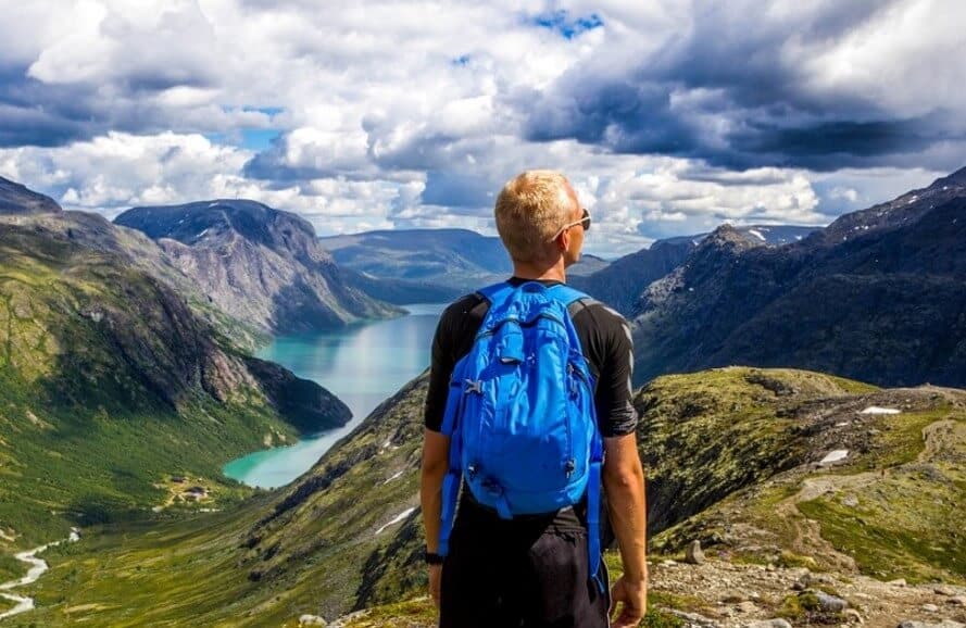 man during day hiking